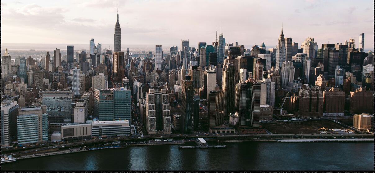 Aerial view of the Manhattan skyline, host city of the AI Engineer Summit 2025